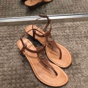 Tan low-heeled thong sandals